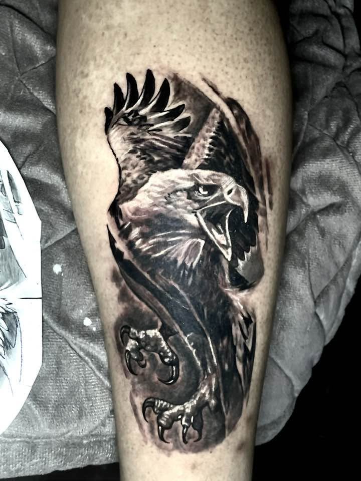 Black and grey eagle tattoo
