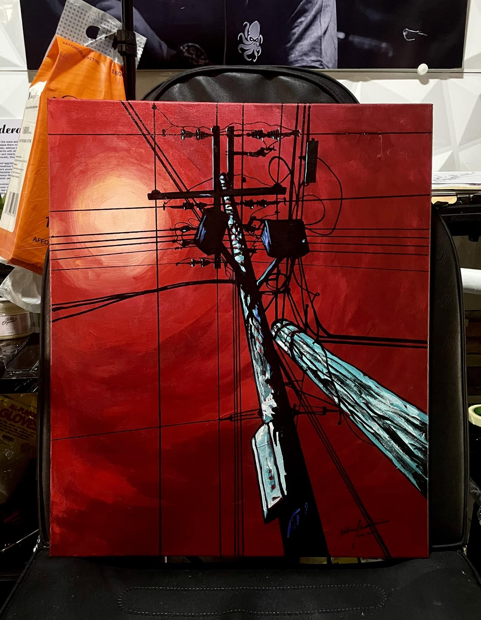 Acrylic painting of power lines against a red sky