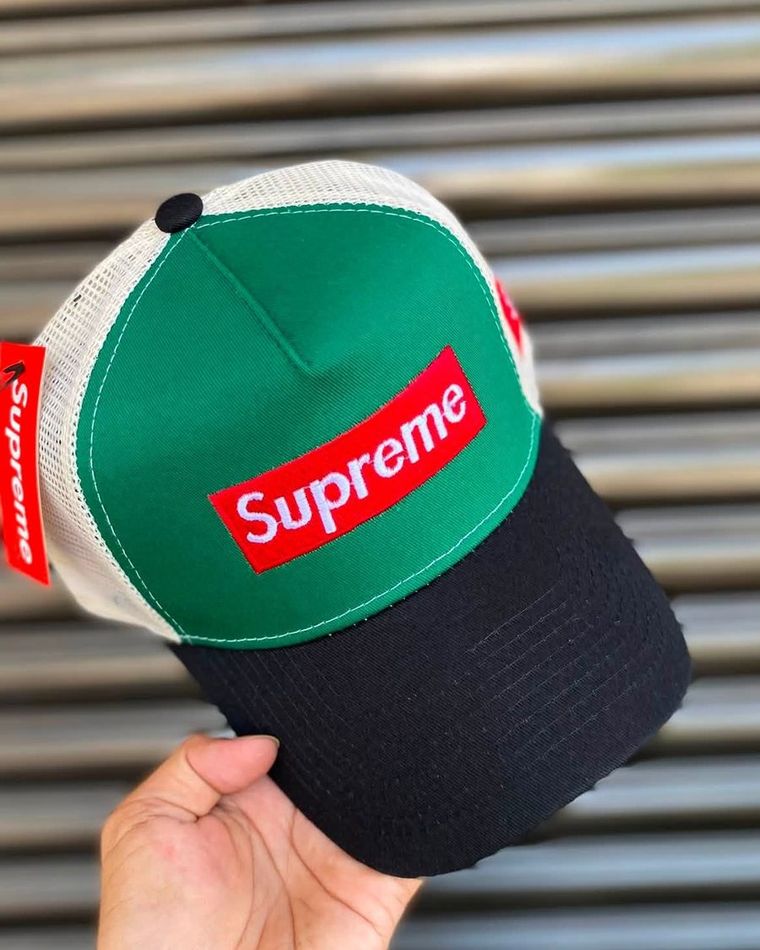 Green panel cap with a navy brim